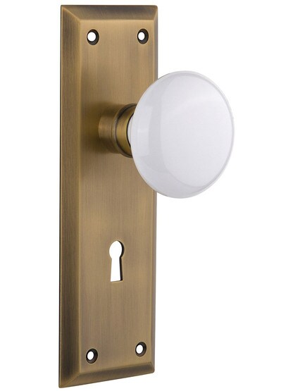 New York Style Door Set with White Porcelain Door Knobs in Antique Brass with.